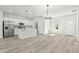 Inviting open-concept living space with modern kitchen, wood-look floors, and updated appliances at 16753 Sw 29Th Terrace, Ocala, FL 34473