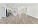 Expansive open floor plan featuring a modern kitchen, wood-look flooring, and recessed lighting at 16753 Sw 29Th Terrace, Ocala, FL 34473