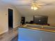 Bright attic bonus room is an ideal versatile flex space with ample ceiling fan lighting at 191 Caldwell St, Apopka, FL 32712
