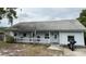 Inviting single-story home with a classic front porch, ideal for relaxing outdoors at 191 Caldwell St, Apopka, FL 32712