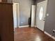 Hallway area with wood-look flooring and multiple doors leading to other rooms at 191 Caldwell St, Apopka, FL 32712