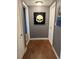 Hallway featuring dark hardwood floors and access to other rooms at 191 Caldwell St, Apopka, FL 32712