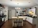 Well-appointed kitchen featuring an island, lots of counter space and modern finishes at 191 Caldwell St, Apopka, FL 32712