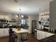 Spacious kitchen with an island, stainless steel appliances, and plenty of counter space at 191 Caldwell St, Apopka, FL 32712