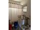 Bathroom with shower/tub combo, linoleum flooring, and vanity at 1933 Bayview Dr, New Smyrna Beach, FL 32168