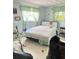 Bedroom with natural light, linoleum flooring, and two windows at 1933 Bayview Dr, New Smyrna Beach, FL 32168