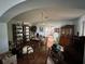 Dining room featuring hardwood floors, a chandelier, and archway to living room at 1933 Bayview Dr, New Smyrna Beach, FL 32168