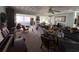 Spacious living room with a ceiling fan, natural light, and ample space for furniture at 1933 Bayview Dr, New Smyrna Beach, FL 32168