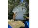 Exterior view of a shed surrounded by trees, with a large garage door at 1933 Bayview Dr, New Smyrna Beach, FL 32168