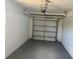 Attached garage with gray painted floor at 2108 Wolf Rd, Orlando, FL 32808