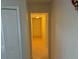 Hallway with tile flooring and an illuminated doorway at 2108 Wolf Rd, Orlando, FL 32808
