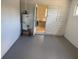 An interior view of the utility room, including a water heater and door to the outside at 2108 Wolf Rd, Orlando, FL 32808