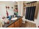 Functional bathroom with a shower-tub combination and a vanity with granite countertops at 212 Lugano Way, Debary, FL 32713