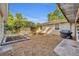 Backyard area showcasing raised garden beds and a grill area, perfect for outdoor enjoyment at 225 N Phippen Ave, Deland, FL 32724