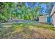 Large green backyard features a playground, basketball court, gazebo, and shed at 225 N Phippen Ave, Deland, FL 32724