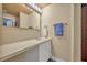 Bathroom with updated sink and cabinet, and a decorative shower curtain at 225 N Phippen Ave, Deland, FL 32724