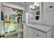 Unique bathroom featuring a vanity with a white countertop and a whimsical shower curtain at 225 N Phippen Ave, Deland, FL 32724