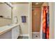 Bathroom featuring a vanity with a sink, and a shower stall with a colorful shower curtain at 225 N Phippen Ave, Deland, FL 32724