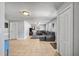 Expansive living area with tile floors, a comfortable seating arrangement, and access to other rooms at 225 N Phippen Ave, Deland, FL 32724