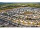 An aerial view of a suburban neighborhood with houses, landscape elements and roads at 2290 Sw Raven Ridge Rd, Clermont, FL 34715