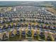 Aerial view of a large residential community with rows of houses and well-maintained lawns at 2290 Sw Raven Ridge Rd, Clermont, FL 34715