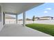 Spacious covered patio offering an unobstructed view of the expansive back yard at 2290 Sw Raven Ridge Rd, Clermont, FL 34715