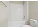 Bathroom featuring a white tiled shower and a tub combination with chrome fixtures at 2290 Sw Raven Ridge Rd, Clermont, FL 34715