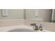 A close-up of the bathroom vanity and sink featuring chrome faucet hardware at 2290 Sw Raven Ridge Rd, Clermont, FL 34715