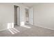 Bedroom with neutral carpet and views into walk-in closet and doorway at 2290 Sw Raven Ridge Rd, Clermont, FL 34715