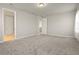 Spacious bedroom with plush carpet and a door that offers access to an ensuite bathroom at 2290 Sw Raven Ridge Rd, Clermont, FL 34715