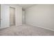 Bedroom with neutral carpet and view into closet and bathroom at 2290 Sw Raven Ridge Rd, Clermont, FL 34715