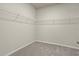 Walk-in closet with carpet and shelving for optimal storage space at 2290 Sw Raven Ridge Rd, Clermont, FL 34715