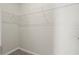 This walk-in closet features a white wire shelving system for optimal storage at 2290 Sw Raven Ridge Rd, Clermont, FL 34715