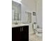 Bathroom featuring a sleek vanity, toilet, and glass shower at 2301 Avellino Ave, St Cloud, FL 34771