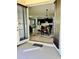 View of a modern dining room with a table and chairs, seamlessly flowing into a sleek kitchen at 2301 Avellino Ave, St Cloud, FL 34771