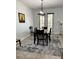 Dining room with tile floor, area rug and modern light fixture at 2301 Avellino Ave, St Cloud, FL 34771