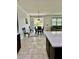 Bright dining room is adjacent to kitchen and includes a pendant light and outdoor view at 2301 Avellino Ave, St Cloud, FL 34771