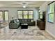 Spacious living room showcases a comfortable sofa, stylish rug, and abundant natural light at 2301 Avellino Ave, St Cloud, FL 34771