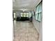 Open concept living area features neutral tile flooring, plenty of natural light, and space for entertaining at 2301 Avellino Ave, St Cloud, FL 34771