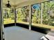This screened porch offers an outdoor space to enjoy nature with stunning wooded views at 2301 Avellino Ave, St Cloud, FL 34771