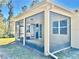 Back view of screened in lanai overlooking lush backyard at 2301 Avellino Ave, St Cloud, FL 34771