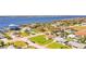 Stunning aerial view of waterfront homes with docks and boats, showcasing the property's desirable location by the water at 2811 S Peninsula Dr, Daytona Beach, FL 32118