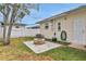 Private backyard with a charming brick fire pit, perfect for outdoor relaxation and gatherings at 2811 S Peninsula Dr, Daytona Beach, FL 32118