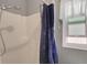Bright bathroom features a shower with modern fixtures and a stylish shower curtain at 2811 S Peninsula Dr, Daytona Beach, FL 32118