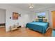 Cozy bedroom with hardwood floors, closet, window, and decorative artwork at 2811 S Peninsula Dr, Daytona Beach, FL 32118
