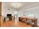 Charming dining room showcasing hardwood floors and views into an adjacent, modern kitchen at 2811 S Peninsula Dr, Daytona Beach, FL 32118