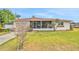 Traditional home featuring a well-kept lawn and inviting front porch perfect for relaxation at 2811 S Peninsula Dr, Daytona Beach, FL 32118
