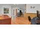 Hallway showcasing hardwood flooring and an open layout, leading to multiple rooms within the home at 2811 S Peninsula Dr, Daytona Beach, FL 32118