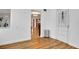 Bright hallway featuring hardwood-style floors and seamless connections to other living spaces at 2811 S Peninsula Dr, Daytona Beach, FL 32118