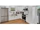 Well-equipped kitchen featuring modern appliances, white cabinetry, and an undermount sink at 2811 S Peninsula Dr, Daytona Beach, FL 32118